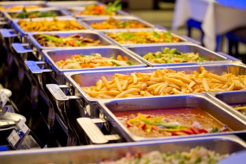 A buffet of foods ranging from vegetables to french fries