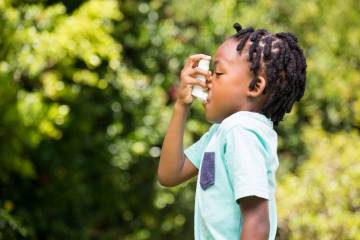 A child uses an inhaler
