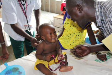 A child with health workers