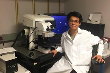 Chung-ha Davis in a lab coat