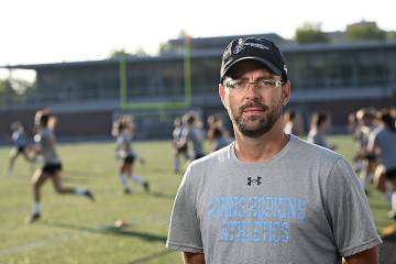 Coach Dan Weiler on the soccer field on the Homewood campus