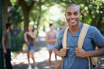 Smiling young man on college campus