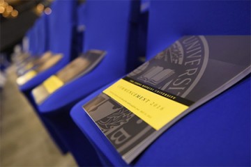 Commencement programs on blue chairs