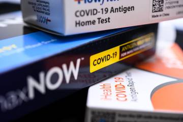 COVID-19 test kits arranged in a stack