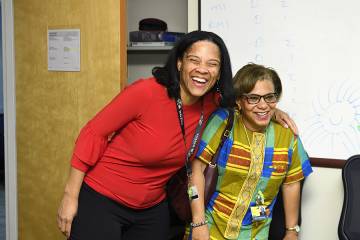Deidra Crews (left) celebrates with Lisa Cooper after being surprised with President's Frontier Award