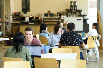 Student study and socialize in a JHU campus coffee shop