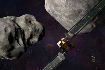 DART spacecraft in space near two asteroids, conceptual image