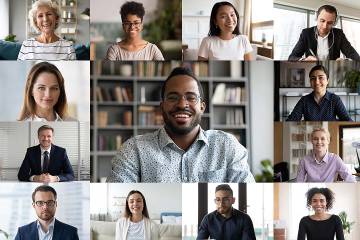 Computer screen showing diverse team members in a virtual meeting