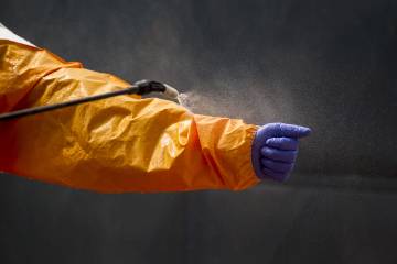 An ebola suit is disinfected
