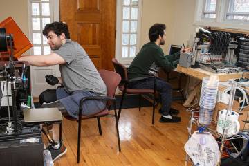 Mark Shiffman and Christopher Shallal work in their home engineering lab