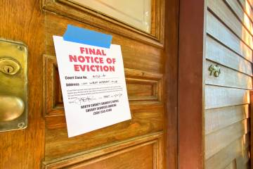 Eviction notice on a wooden door