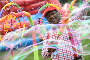 Man with bubble-making machine at Fall Fest