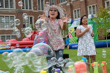 Two women enjoy games at Fall Fest 2017