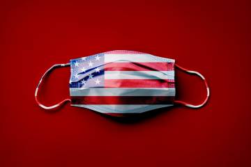 Face mask with American flag pattern against red background