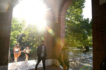 Bright sun flare through campus archway