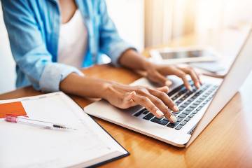 Woman’s hands on laptop keyboard