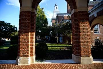 Gilman Hall and brick archways on Johns Hopkins University's Homewood campus