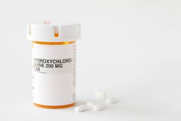 Hydroxychloroquine tablets on white background