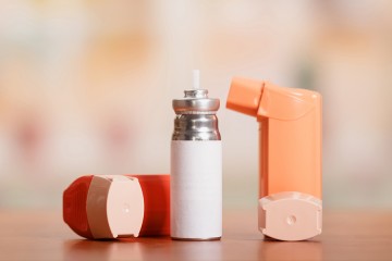 Two inhalers and a canister of albuterol