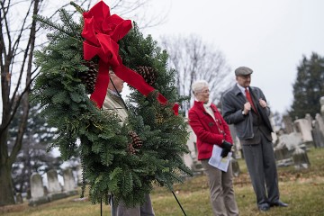 A wreath placed at the tombstone marks the completion of the brief ceremony held each year.