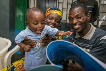 In Nigeria, both mothers and fathers are welcome to attend Jhpiego’s group antenatal care classes, in an effort to promote gender equality. Kasuwa Sunday and her husband Luka Sunday play with their 7-month-old daughter Mercy in Nasawara State. 