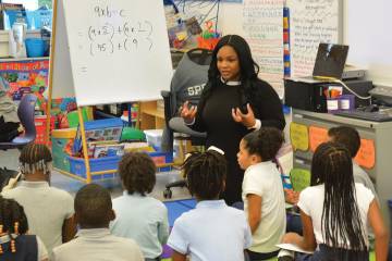 Kelly Harper teaches a group of students