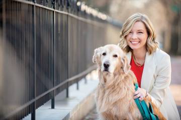 Pollster Kristen Soltis Anderson poses with her golden retriever, Wally
