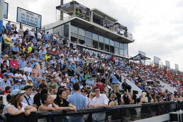 Fans cheering on the men’s lacrosse team on Homewood Field