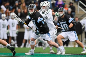 Hopkins lacrosse player evades Loyola defender