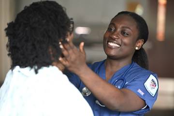 A nursing student checks lymph nodes
