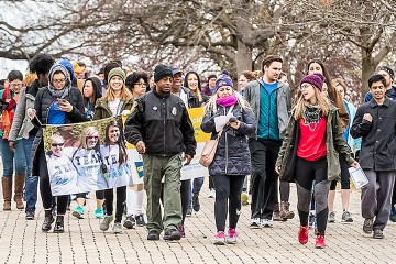 Participants walk through Patterson Park during the Out of the Darkness Campus Walk 