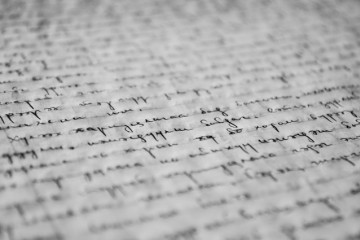 A close-up of cursive writing on lined paper