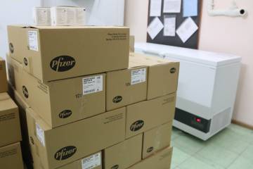 Boxed Pfizer vaccines are shipped overseas