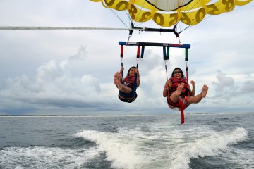 two girls parasailing