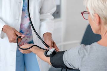 Woman getting her blood pressure checked