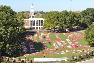 Aerial shot of the Monument Quilt on the JHU Beach, forming the words 