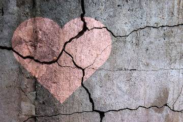 Drawing of a heart on a cracked wall