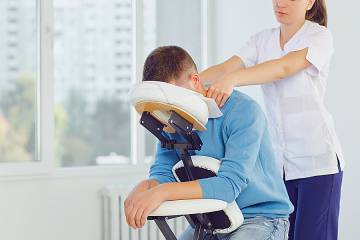 Man receiving seated massage