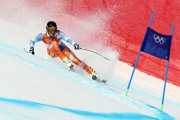Olympic downhill skier makes a turn
