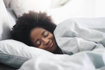 Woman in bed sleeping peacefully