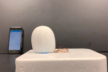 A snail-like robot inches forward on a table