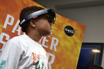 A boy wears the parker Solar Probe augmented reality headset