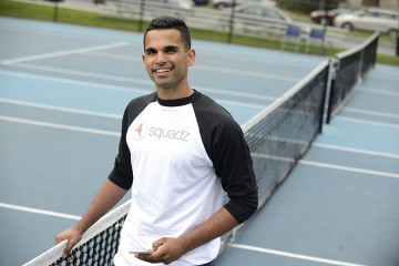 Nikhil Panu poses on a tennis court