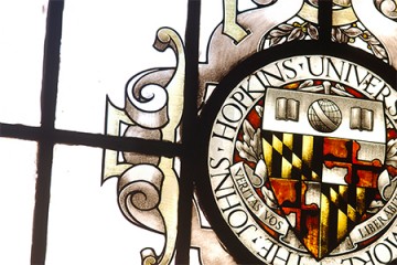 Johns Hopkins University seal in stained glass