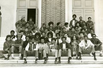 Students seated on the steps of Shriver Hall