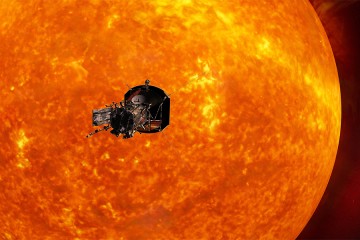 Parker Solar Probe silhouetted against the massive, orange sun