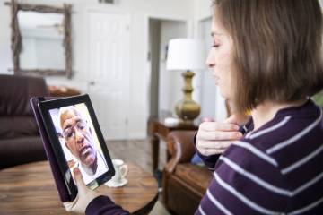 A doctor and patient meet virtually