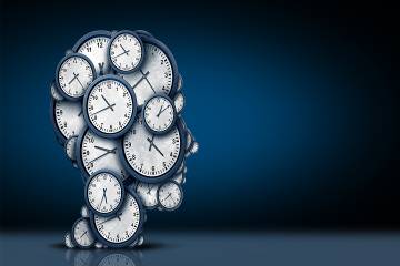 Clock faces assembled in the shape of a head