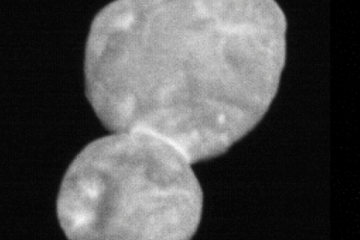 A blurry image of an object formed by two spheres