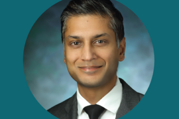 Head shot of Sashank Reddy, a man of South Asian heritage wearing a suit